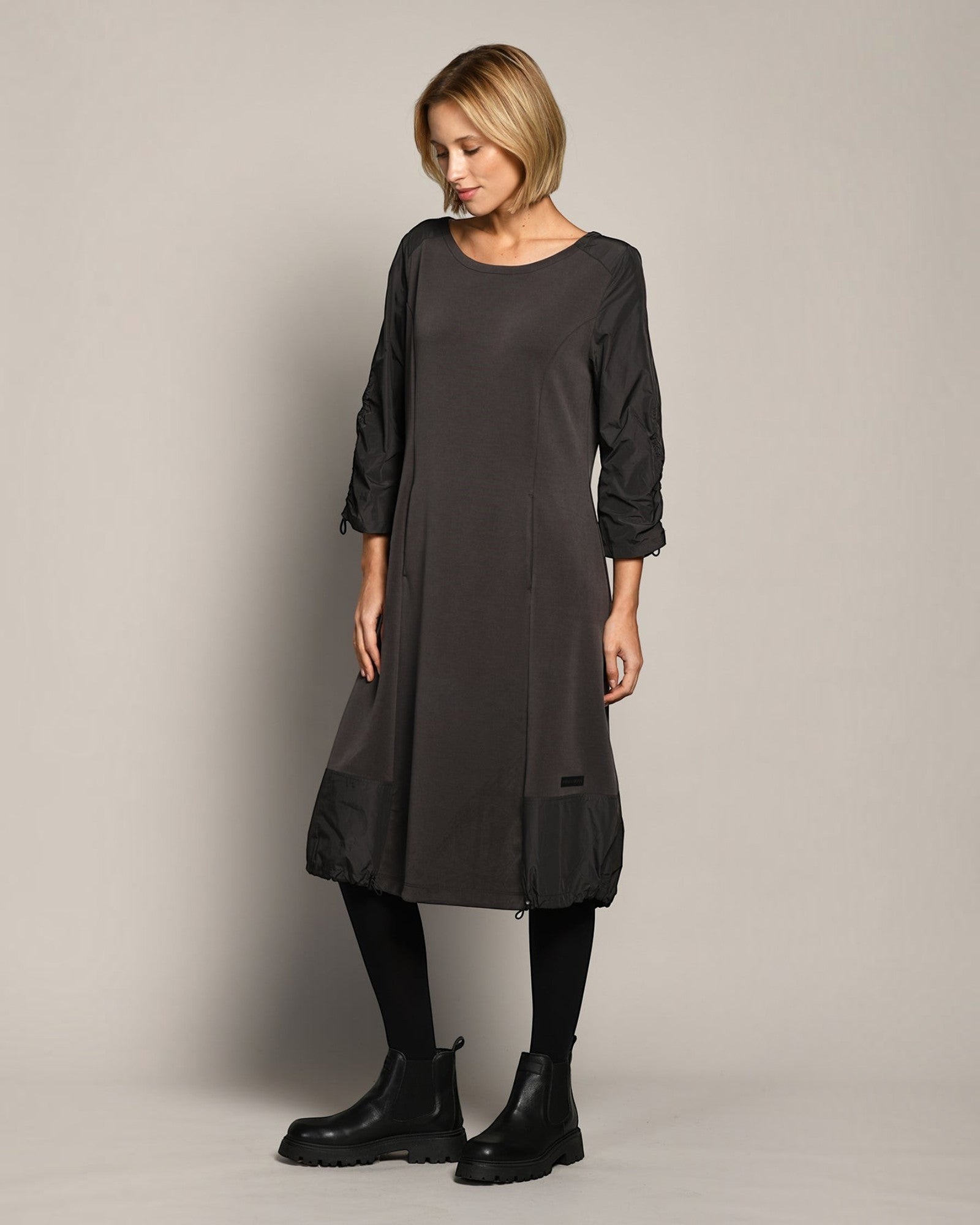 LEEZZA Amber & Moon DIVA black scuba jersey balloon dress with 3/4 sleeves and adjustable hem on a model