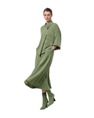 LEEZZA model wearing a sage green LOTUS EATERS AGONION oversized modal jersey vest with asymmetrical button closure.