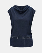 LEEZZA LOTUS EATERS sleeveless dark denim top with a draped neckline, buttoned hem detail, and front pocket.